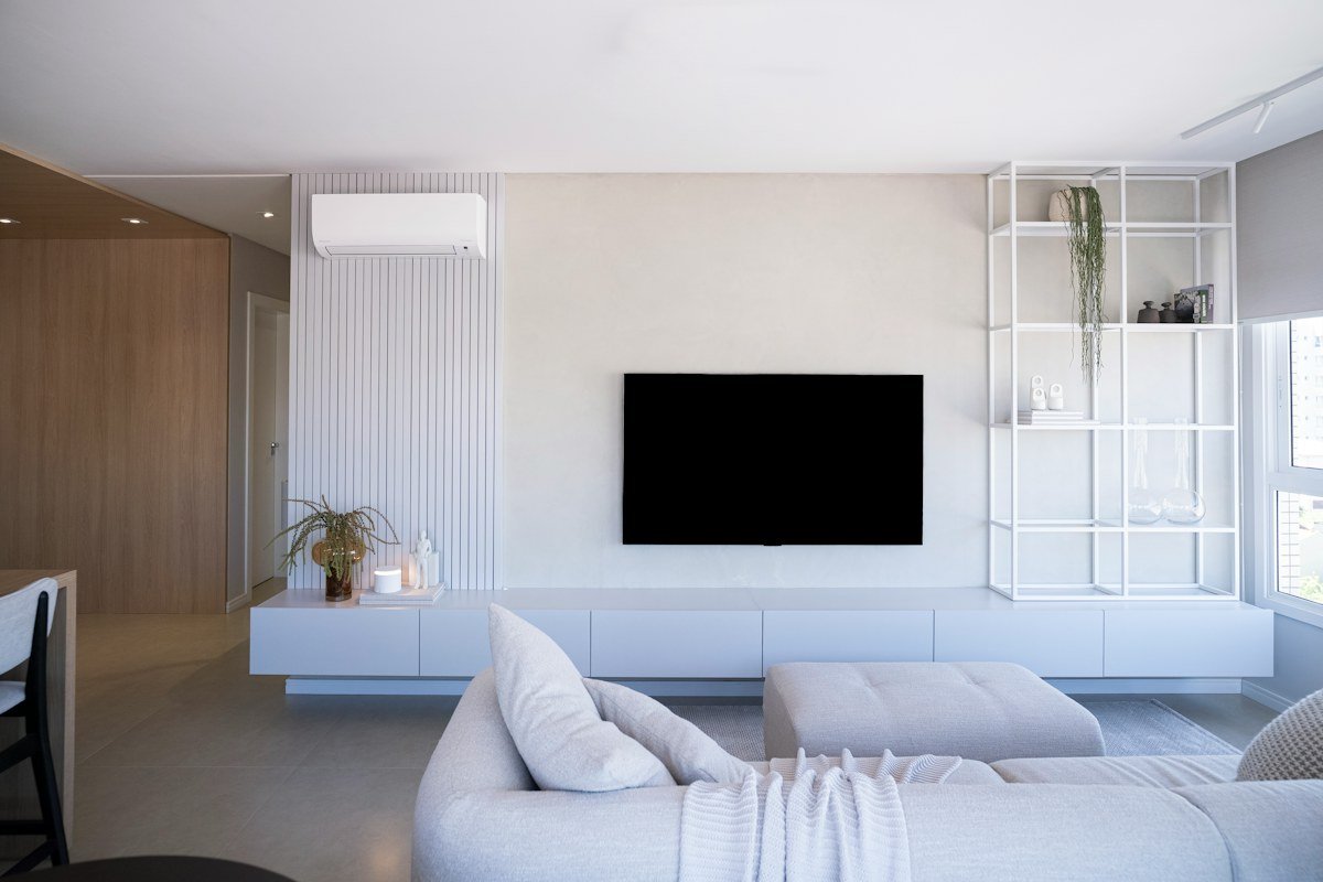 Modern living room TV wall with asymmetrical decor and a low media console