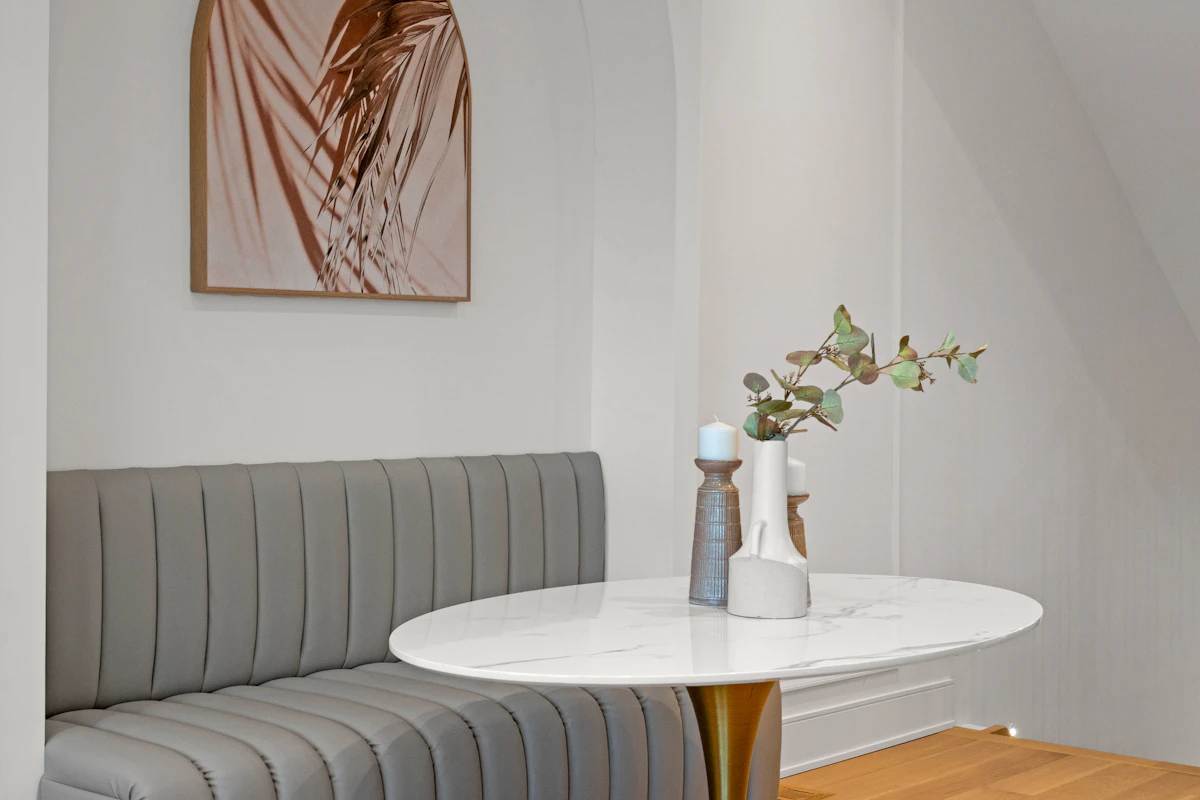 Compact dining nook with banquette seating and a small table