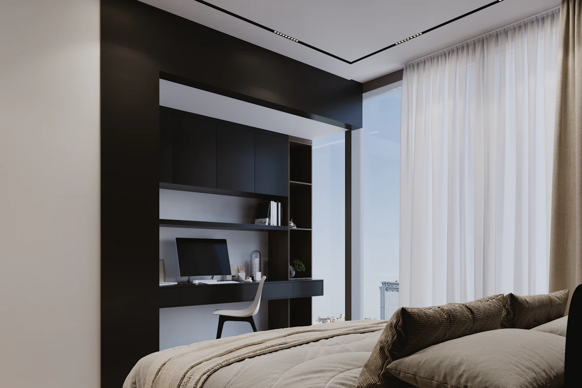 Modern bedroom with a compact built in desk beside the bed