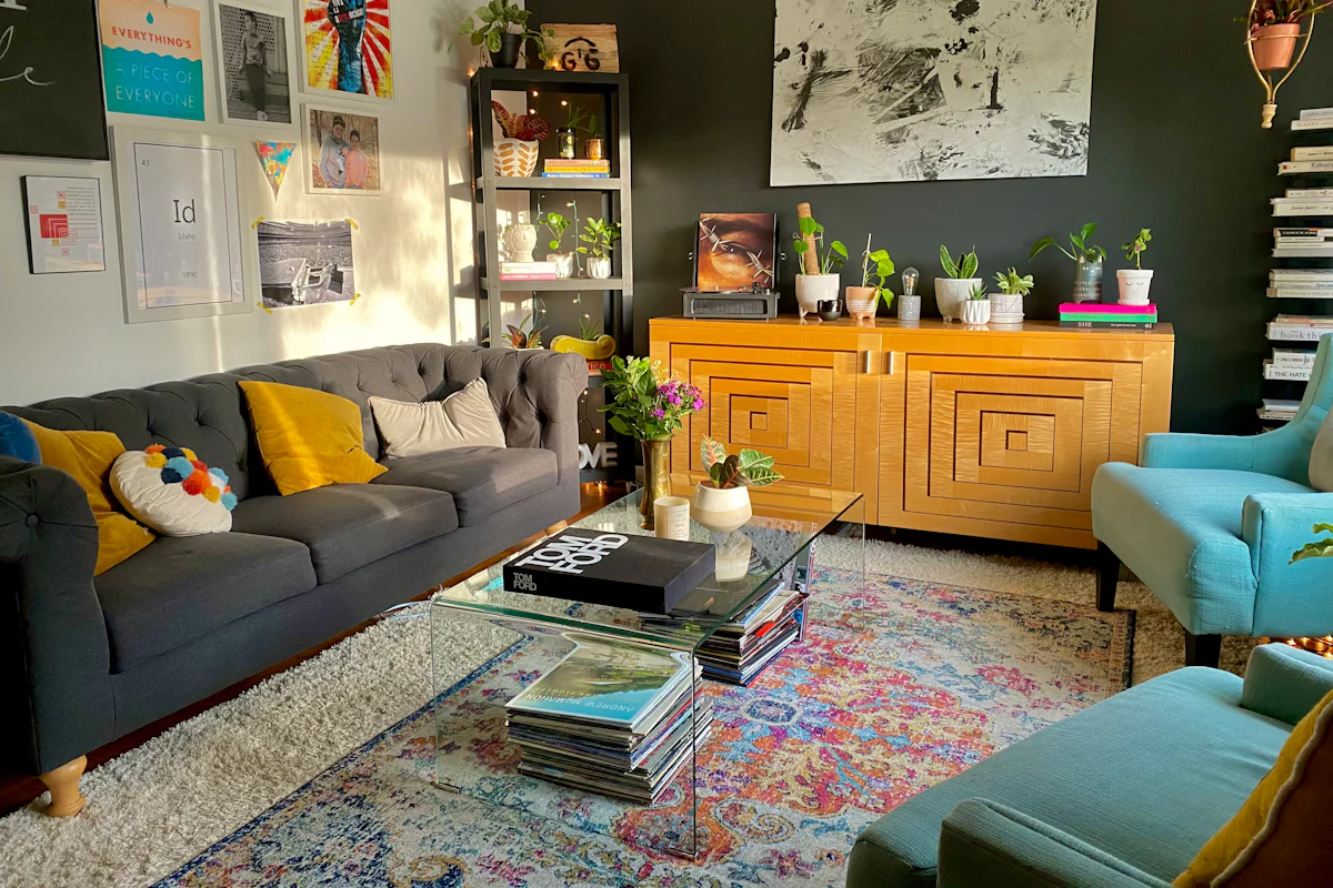 Living room with wallpaper used as a decorative accent wall behind seating