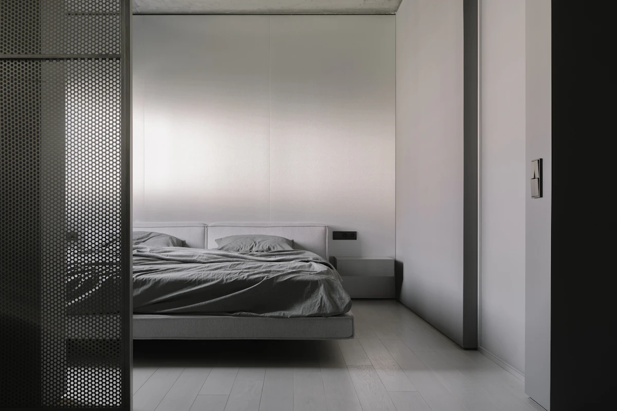 Modern bedroom zone separated from the rest of an apartment with a semi open partition