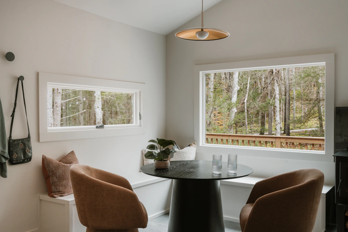 Small apartment dining nook with a round table and compact seating