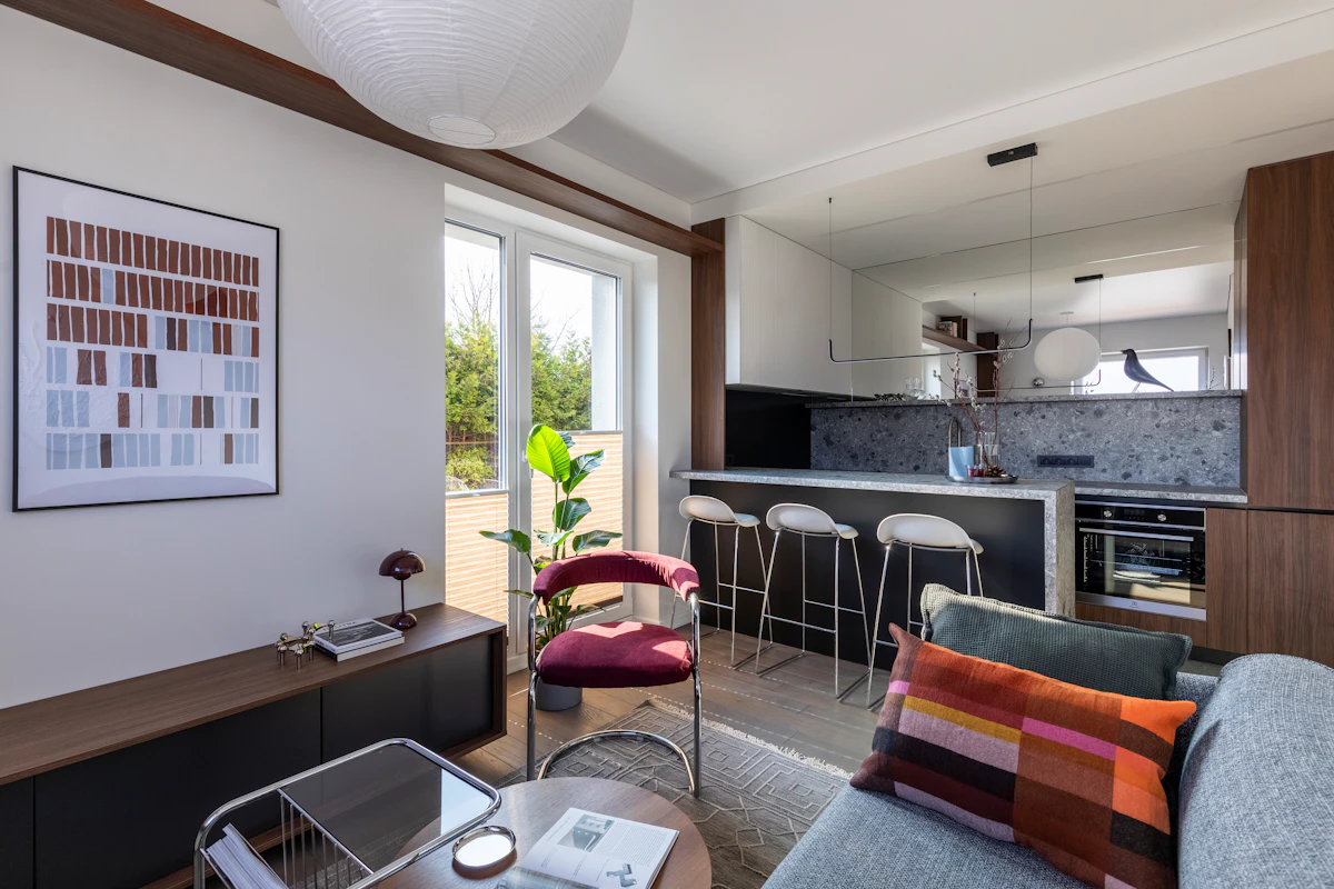 Small open-plan apartment with a compact dining area positioned near the kitchen