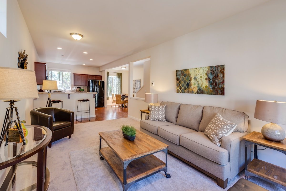 Apartment living room using vertical wall space and decor efficiently