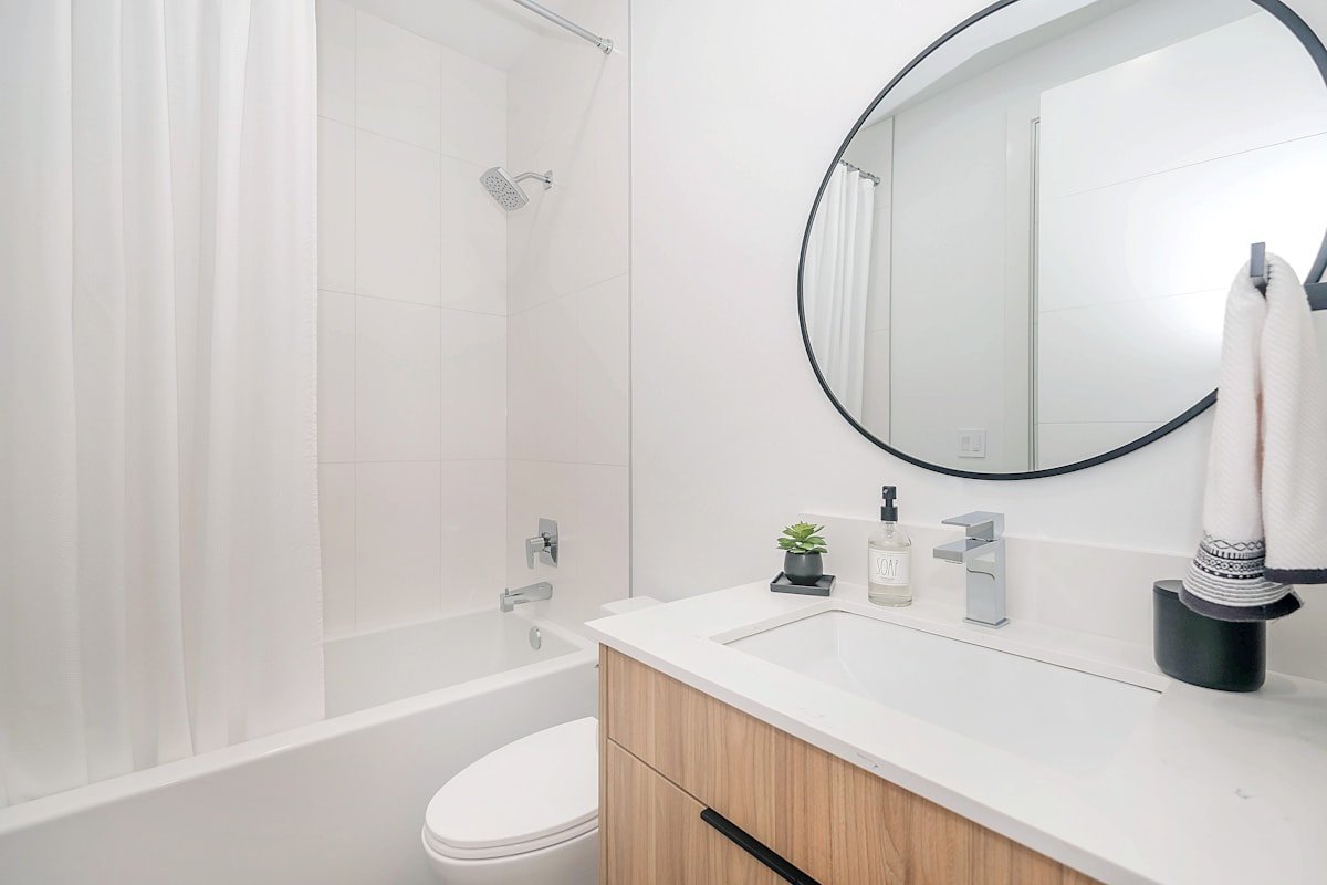 Bathroom vanity sink and mirror with simple modern finishes