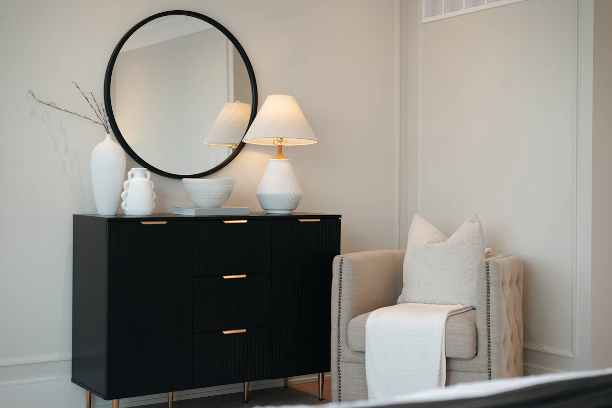 Bedroom dresser with wall mirror and balanced decor above it