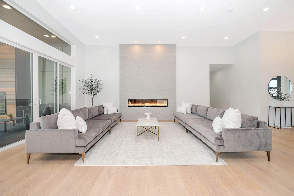 Large living room with two sofas and an area rug unifying the conversation zone
