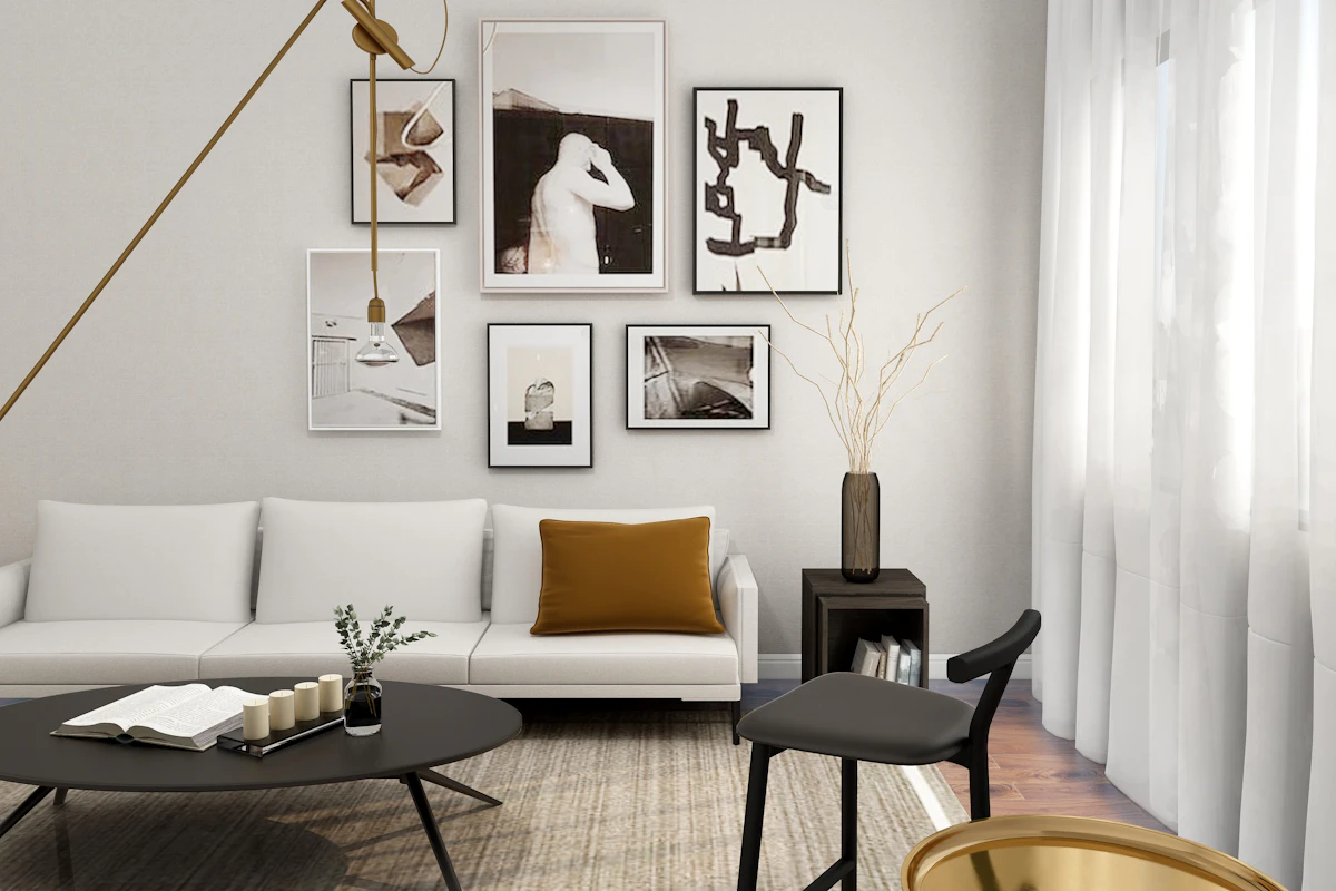 Living room with a coordinated gallery wall of framed art above a white sofa
