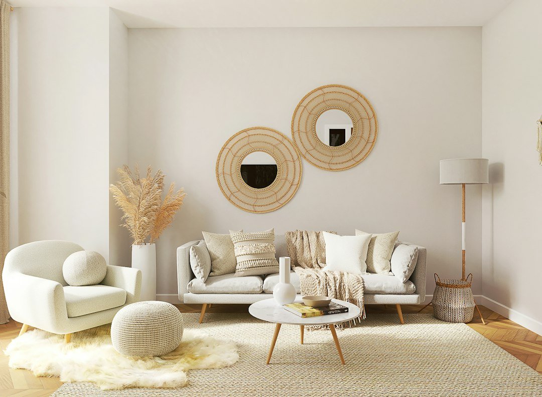 Living room with coordinated wall decor, mirror, and furniture