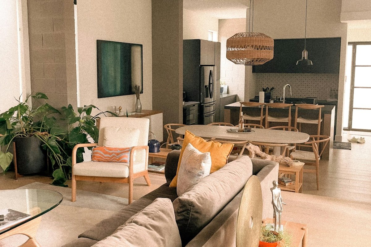 Modern open-plan living dining and kitchen areas with coordinated neutral colors