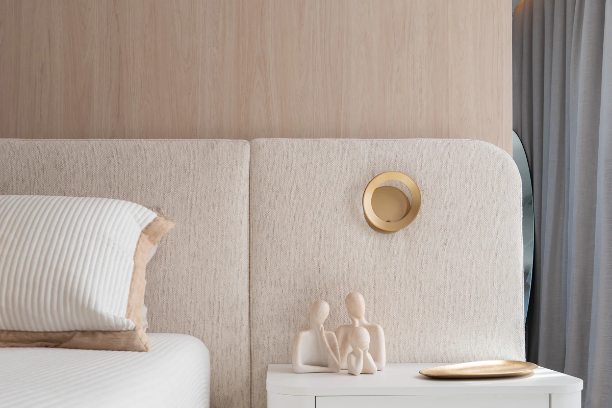 Neutral bedroom with minimalist wall decor and bedside furniture