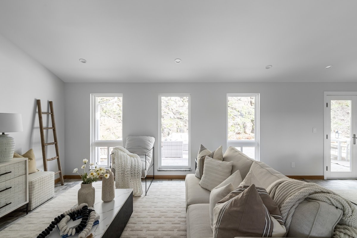 Neutral living room with natural light wood and soft gray accents