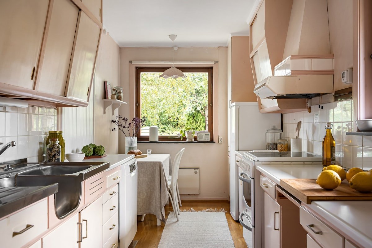 Small kitchen with generous counter space, light finishes and minimal visual clutter